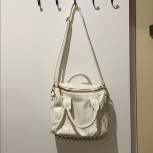 white and gold studded purse